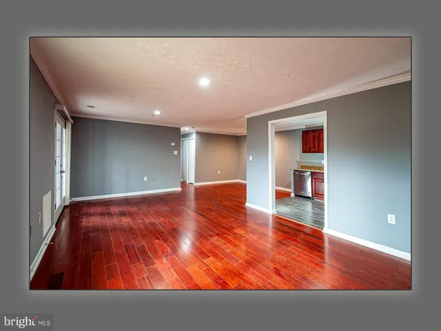 a kitchen with stainless steel appliances granite countertop a refrigerator stove top oven a sink and dishwasher