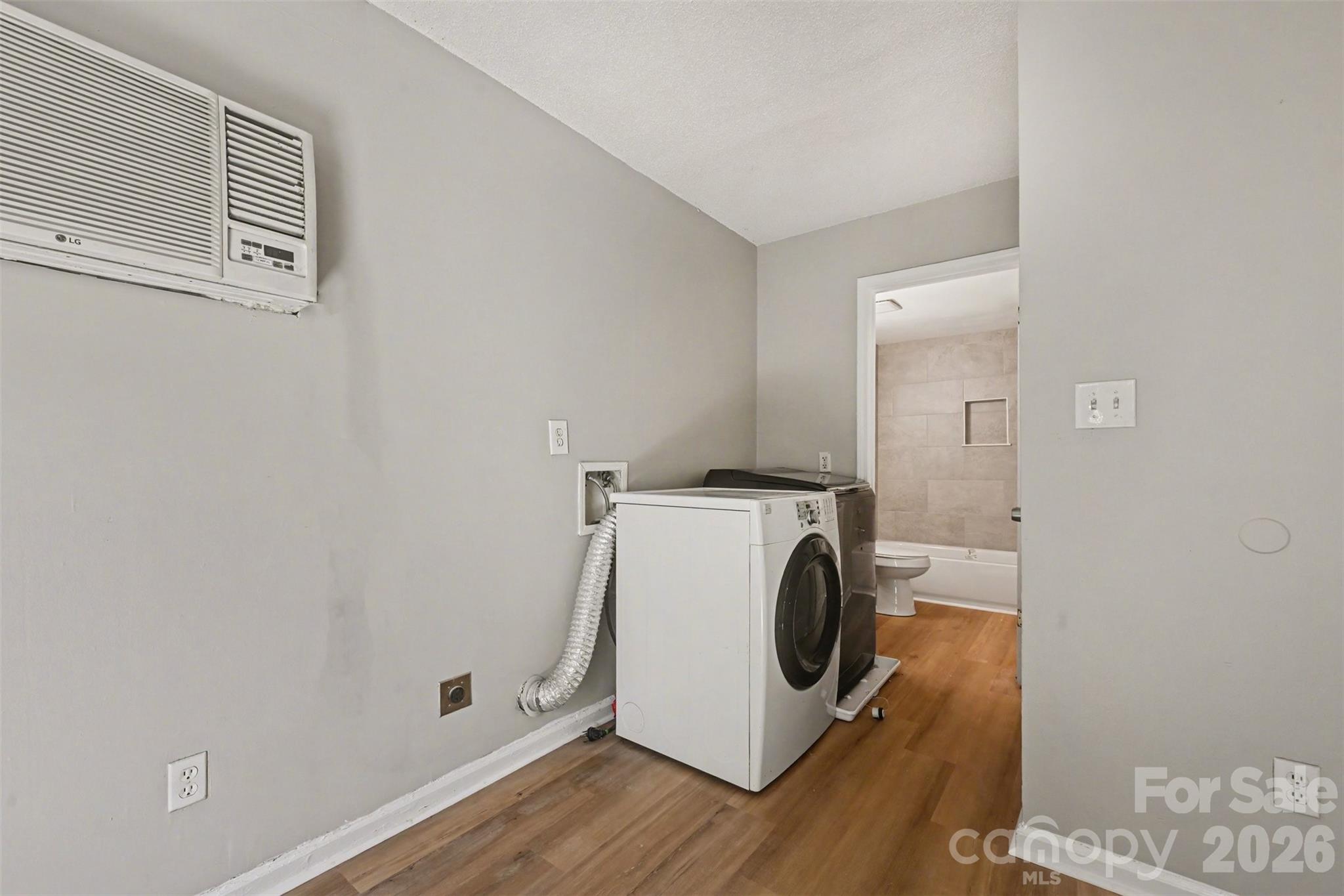 270-272 Spring Street Southwest Concord, NC 28025 - Photo 12 of 26 a utility room with dryer and washer