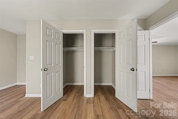 a view of hallway with wooden floor