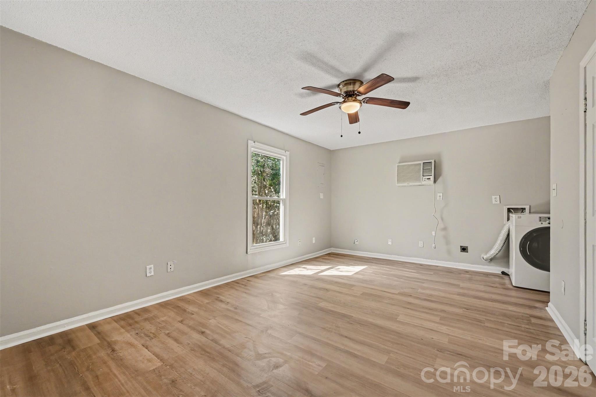 270-272 Spring Street Southwest Concord, NC 28025 - Photo 9 of 26 a view of a livingroom with a workspace
