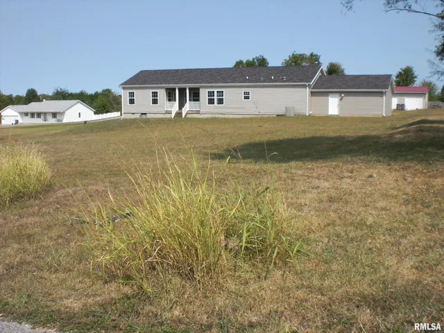 a house with trees in the background
