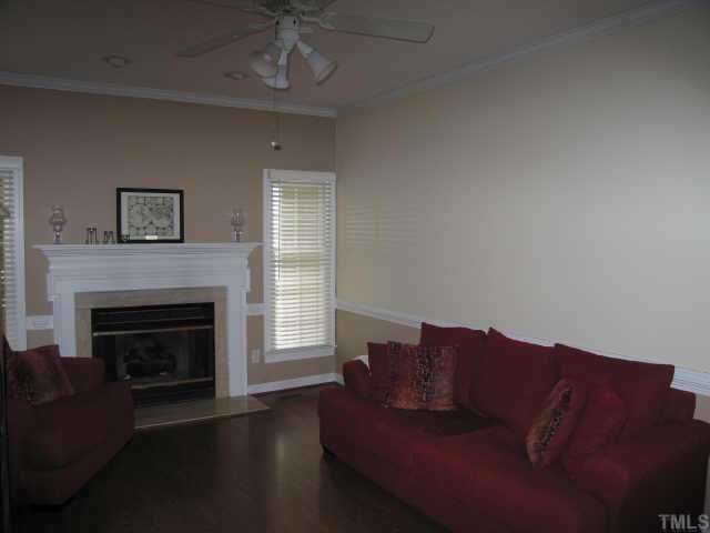 5616 Raddington Street Raleigh, NC 27613 - Photo 8 of 10 Family room has gas log fireplace and opens to the deck Other