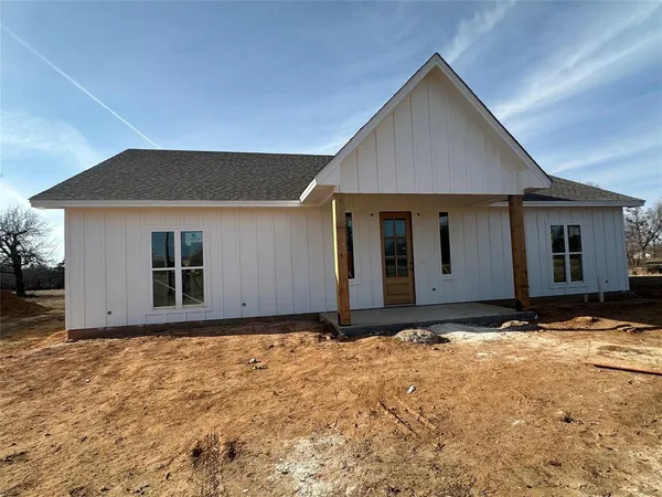 a house with yard in front of it