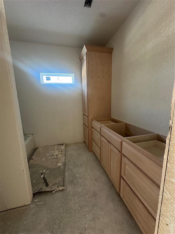 518 Strong Street Bowie, TX 76230 - Photo 12 of 14 a room with storage and utility