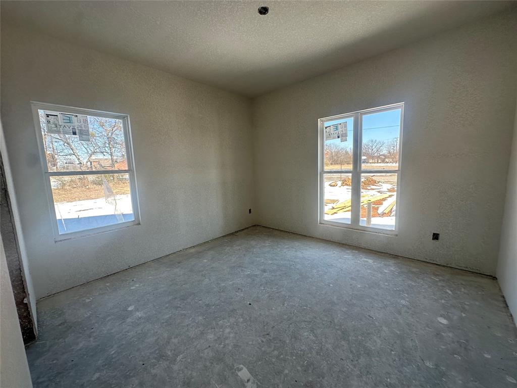 518 Strong Street Bowie, TX 76230 - Photo 13 of 14 an empty room with windows