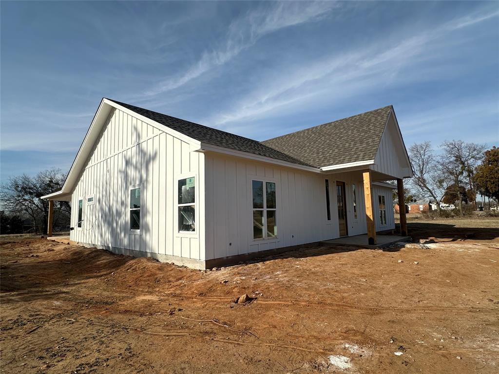 518 Strong Street Bowie, TX 76230 - Photo 2 of 14 a front view of a house with a yard