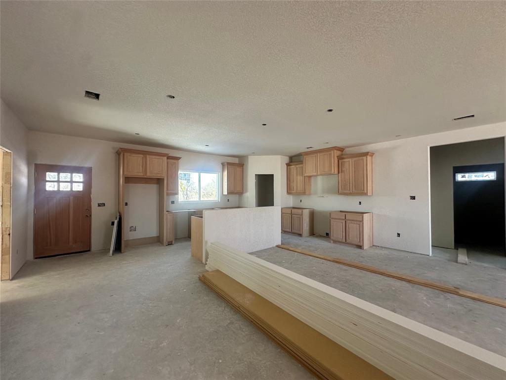 518 Strong Street Bowie, TX 76230 - Photo 4 of 14 a view of a livingroom with furniture and windows