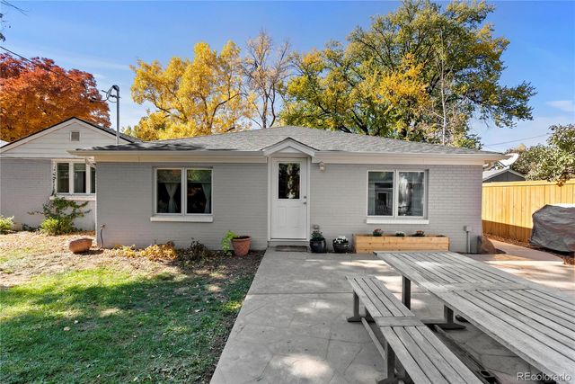 a view of a backyard with a sitting area