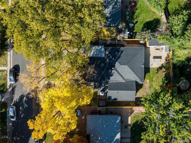 an aerial view of residential houses with outdoor space