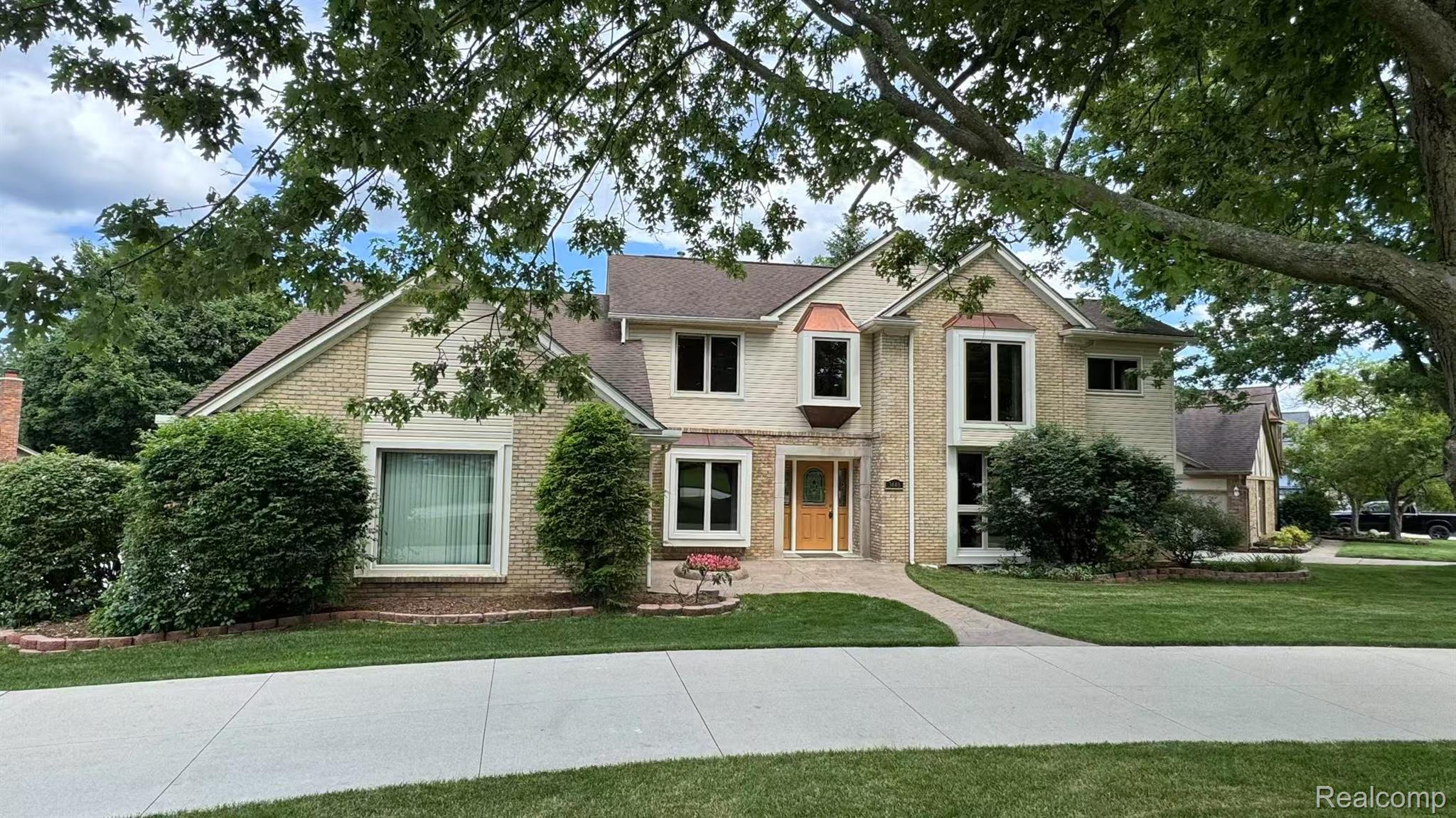 3440 Salem Drive Rochester, MI 48306 - Photo 1 of 33 Traditional two-story residence featuring brick and siding facade with a gabled roof