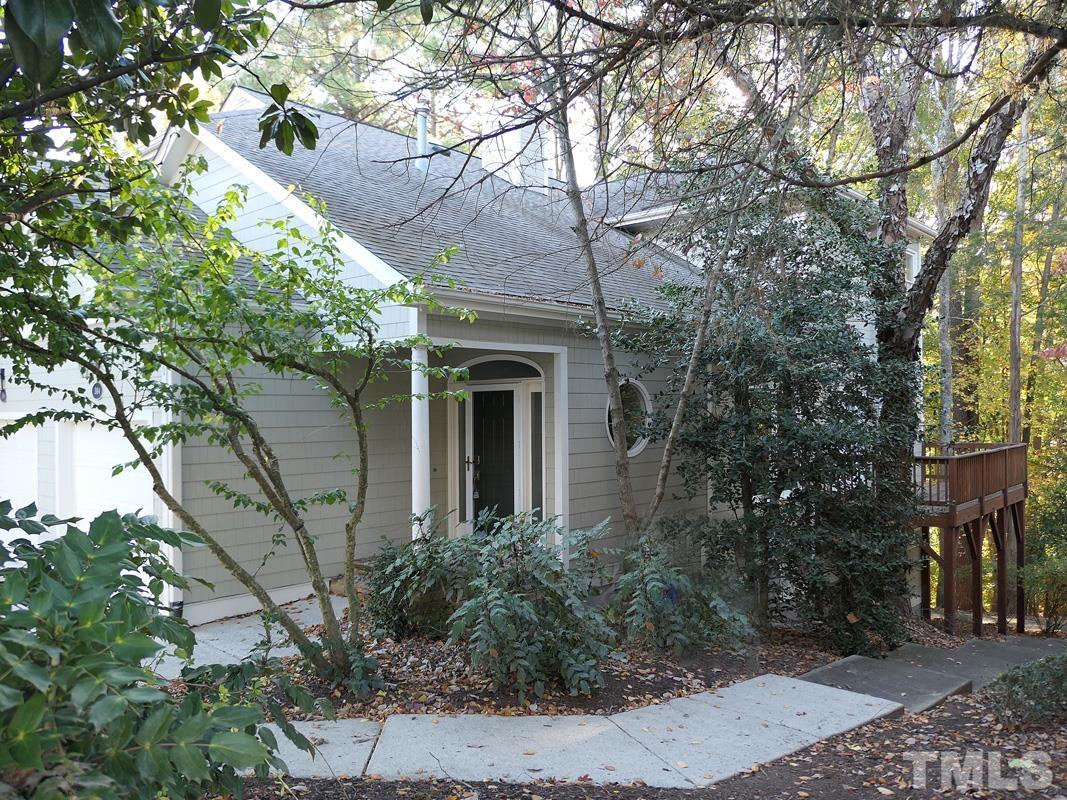 a view of a house with a tree