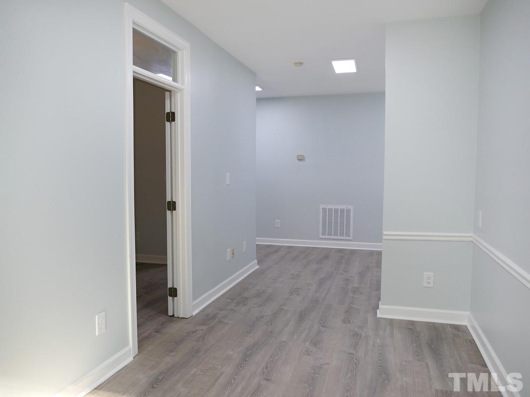 304 Columbia Place East Chapel Hill, NC 27516 - Photo 19 of 34 wooden floor in an empty room with a window