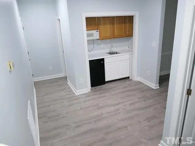a view of a bathroom with a sink and a mirror