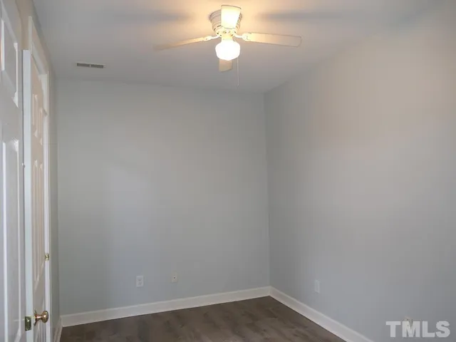 a view of empty room with fan