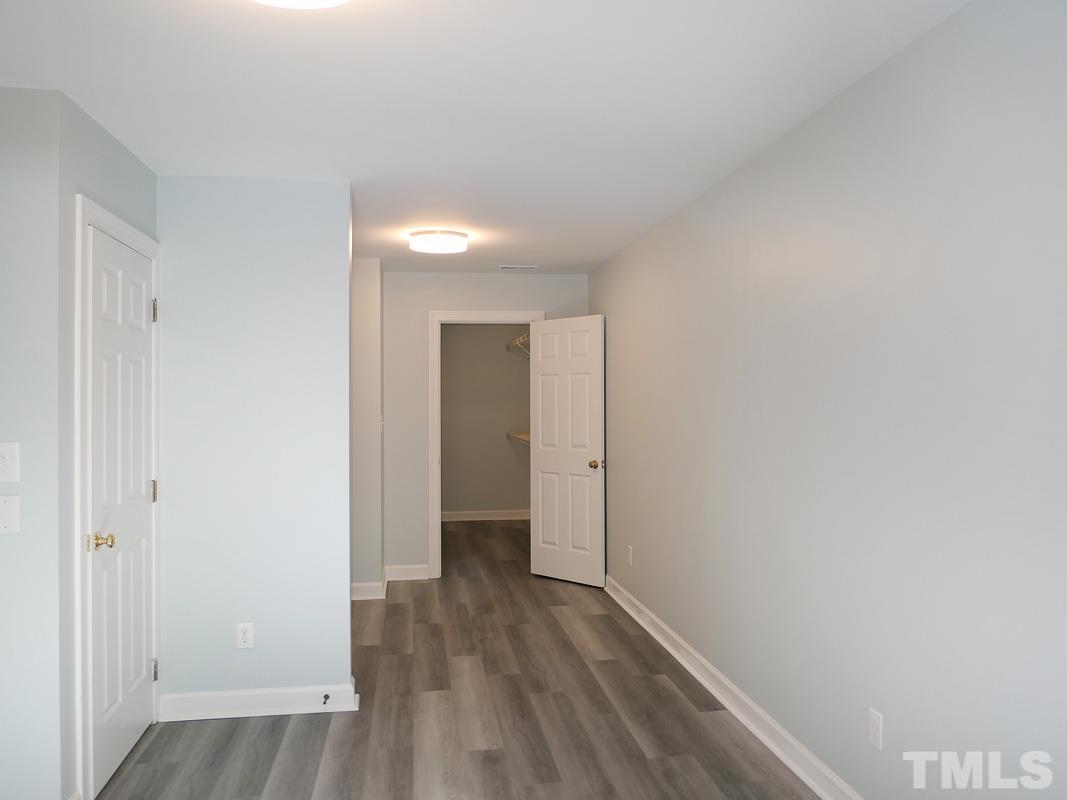 304 Columbia Place East Chapel Hill, NC 27516 - Photo 24 of 34 a view of hallway with wooden floor