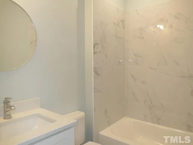 a bathroom with a sink and a bathtub