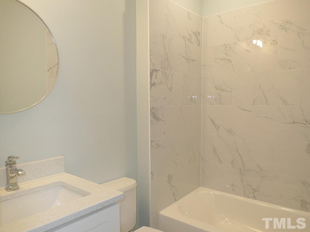 304 Columbia Place East Chapel Hill, NC 27516 - Photo 29 of 34 a bathroom with a sink and a bathtub