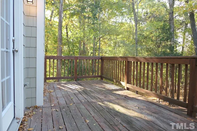 a view of balcony with wooden floor