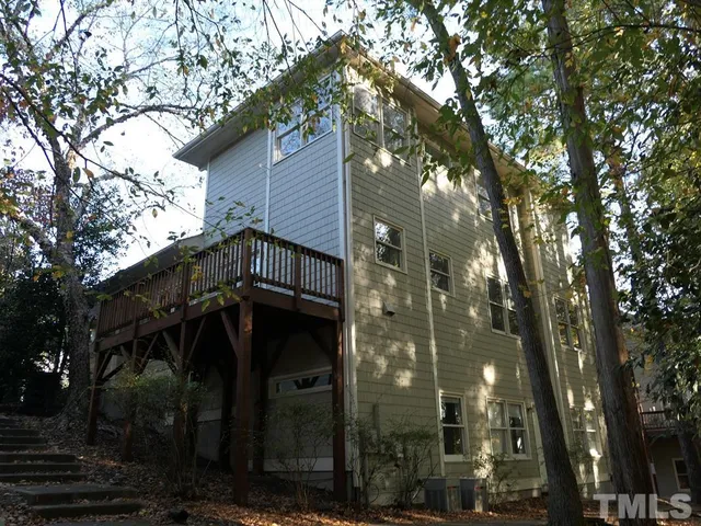 a view of a house with a tree