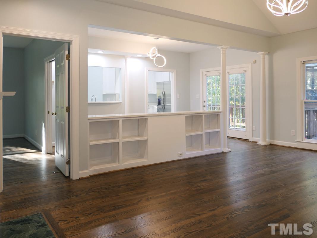 304 Columbia Place East Chapel Hill, NC 27516 - Photo 7 of 34 a view of a kitchen with wooden floor and a window