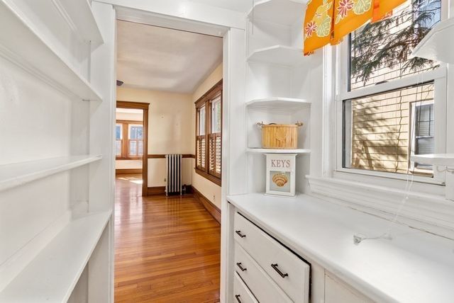 a view of a kitchen cabinets and a wooden floor