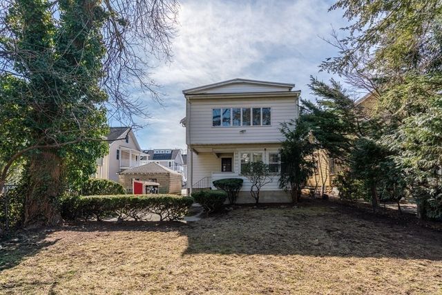 a front view of a building with garden