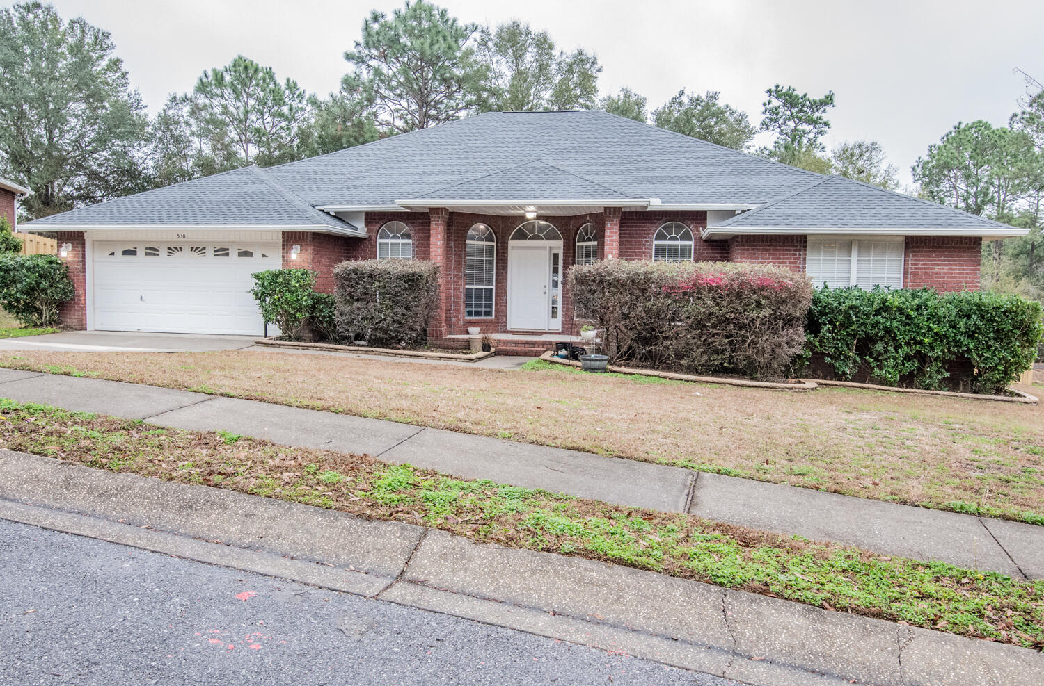 530 Vulpes Sanctuary Loop Crestview, FL 32536 - Photo 1 of 31 front view of a house and a yard