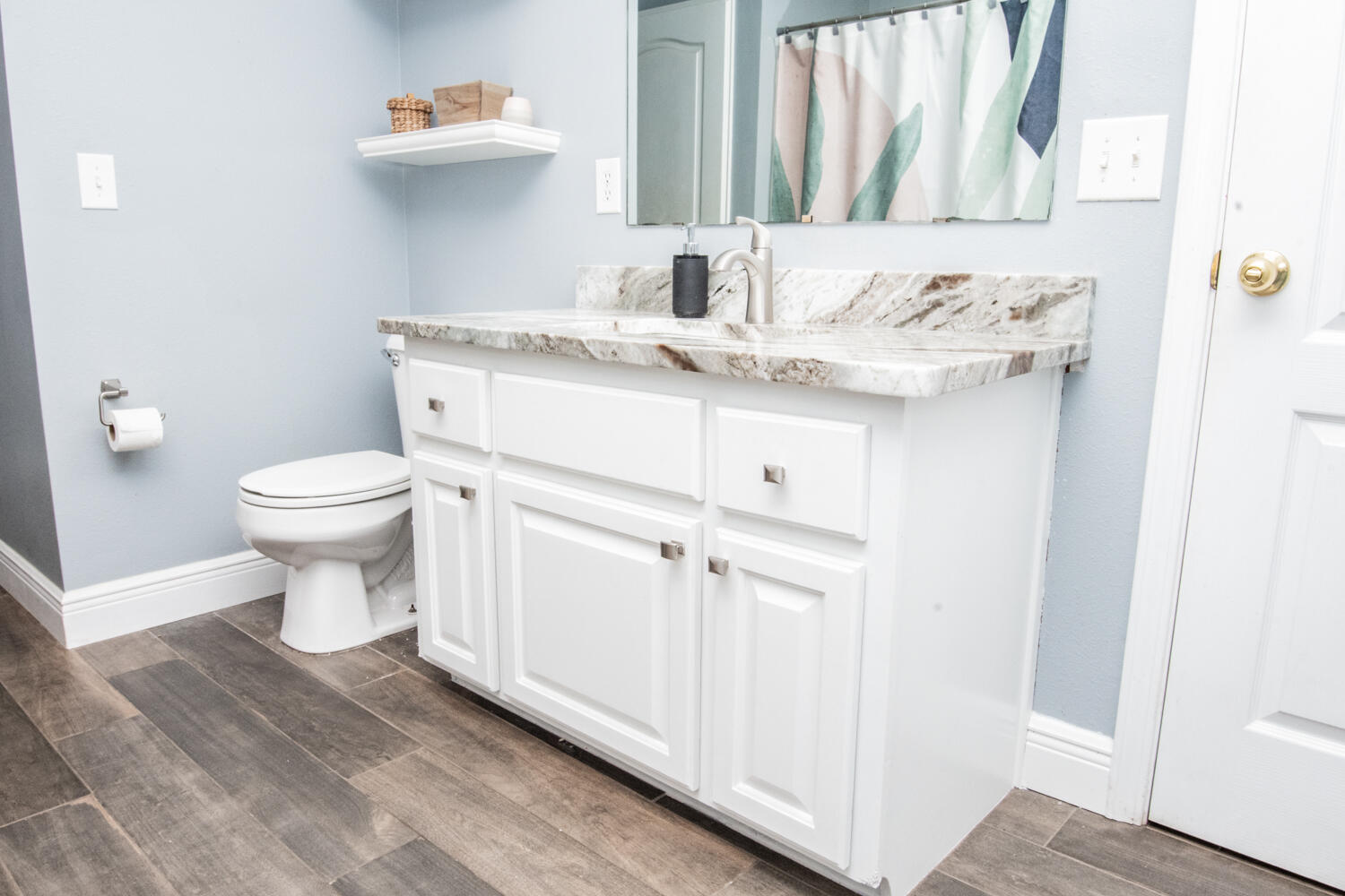 530 Vulpes Sanctuary Loop Crestview, FL 32536 - Photo 19 of 31 a bathroom with a granite countertop toilet sink and mirror