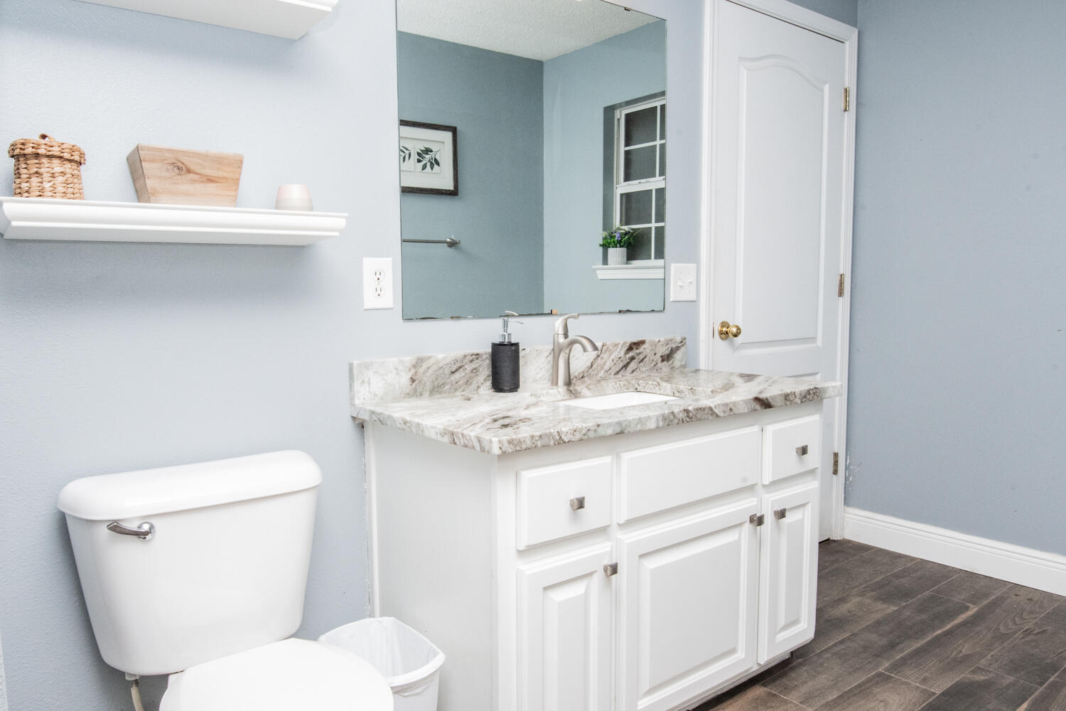 530 Vulpes Sanctuary Loop Crestview, FL 32536 - Photo 21 of 31 a bathroom with a granite countertop toilet sink and mirror