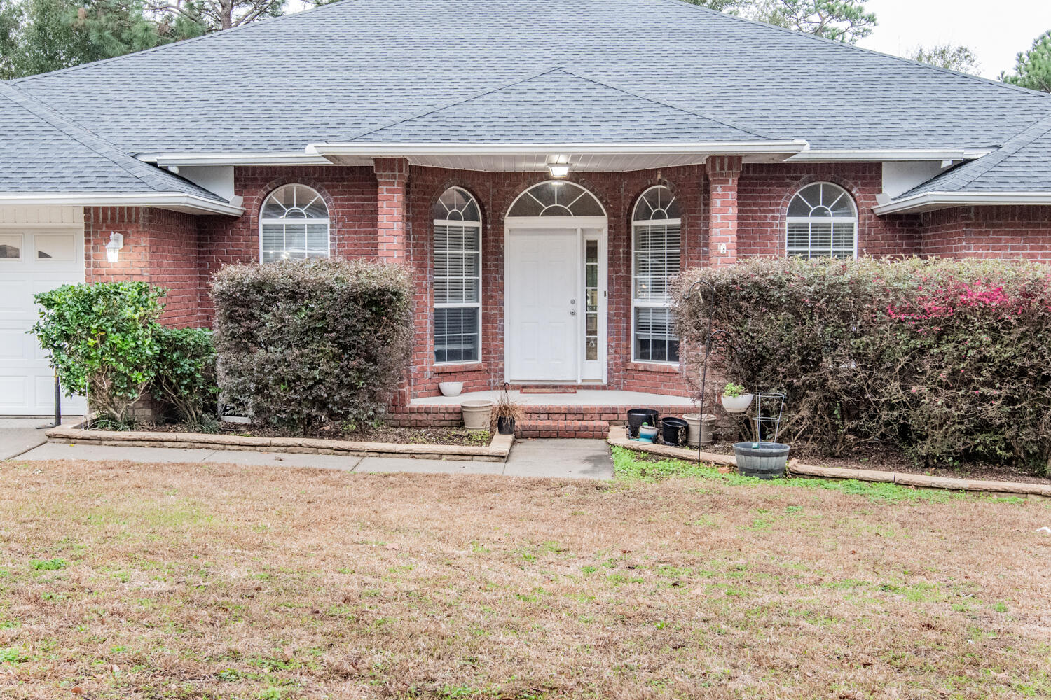 530 Vulpes Sanctuary Loop Crestview, FL 32536 - Photo 4 of 31 front view of house with a yard