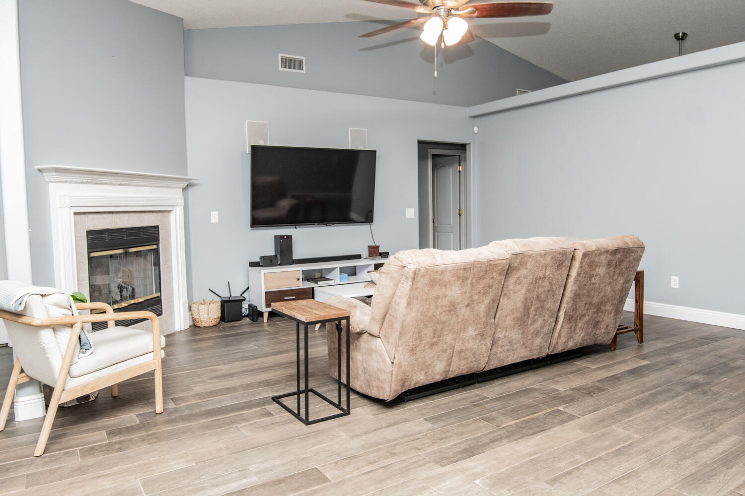 530 Vulpes Sanctuary Loop Crestview, FL 32536 - Photo 6 of 31 a living room with a couch and a flat screen tv