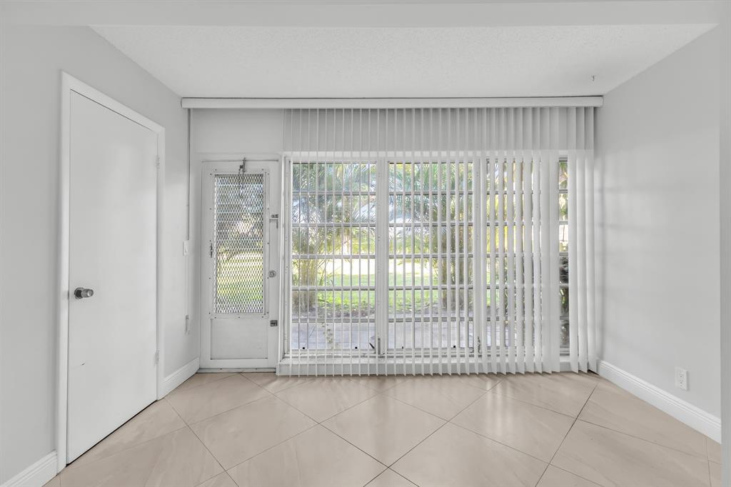 13950 Vía Flora, Unit B Delray Beach, FL 33484 - Photo 12 of 28 a view of a room that has a large window