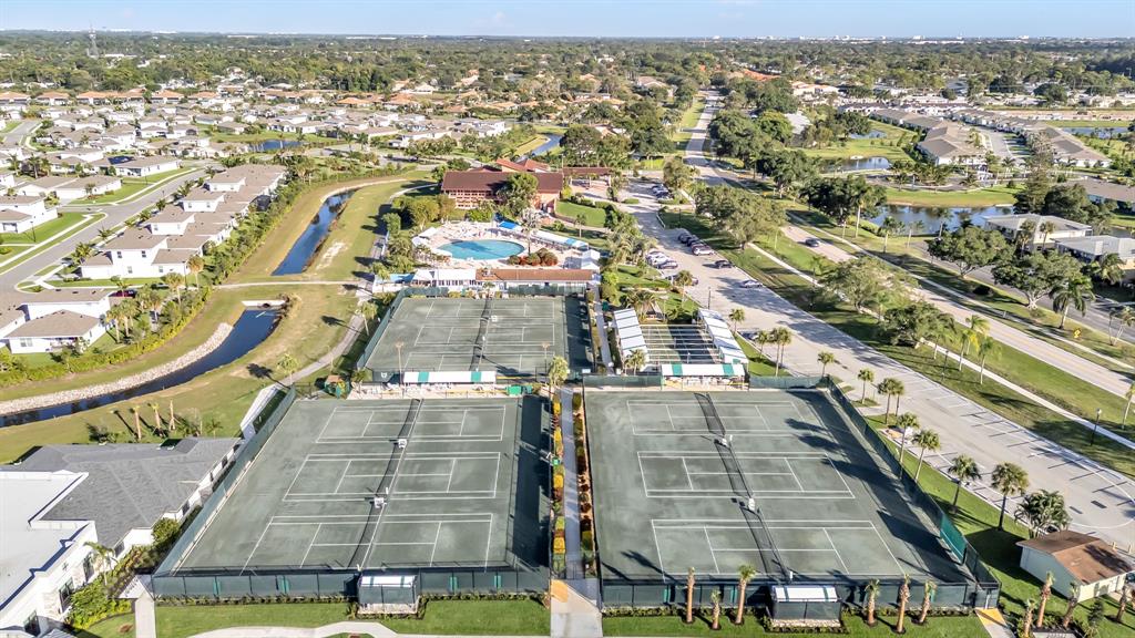 13950 Vía Flora, Unit B Delray Beach, FL 33484 - Photo 21 of 28 an aerial view of residential houses with outdoor space