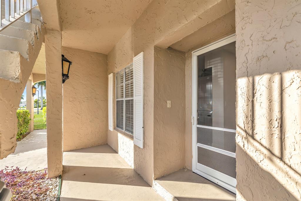 13950 Vía Flora, Unit B Delray Beach, FL 33484 - Photo 28 of 28 a view of front door