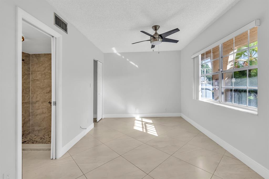 13950 Vía Flora, Unit B Delray Beach, FL 33484 - Photo 5 of 28 a view of entryway with front door