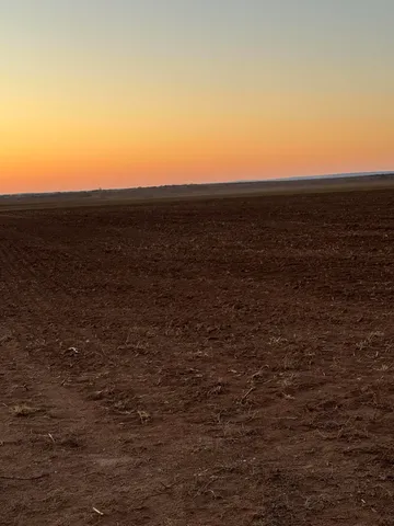 a view of ocean with green space