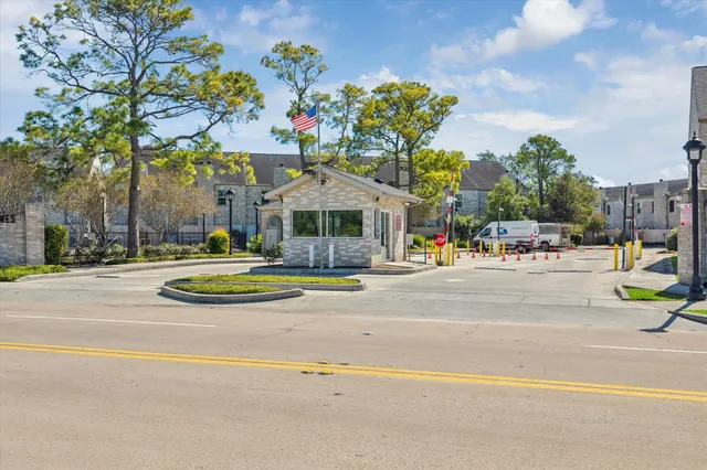 a view of a swimming pool with a lawn chairs