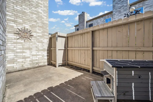 a view of a kitchen with a sink and a window