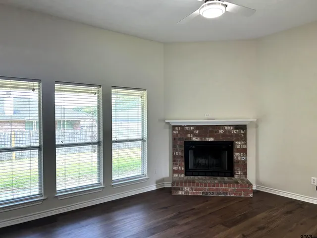 a living room with fireplace and a fireplace