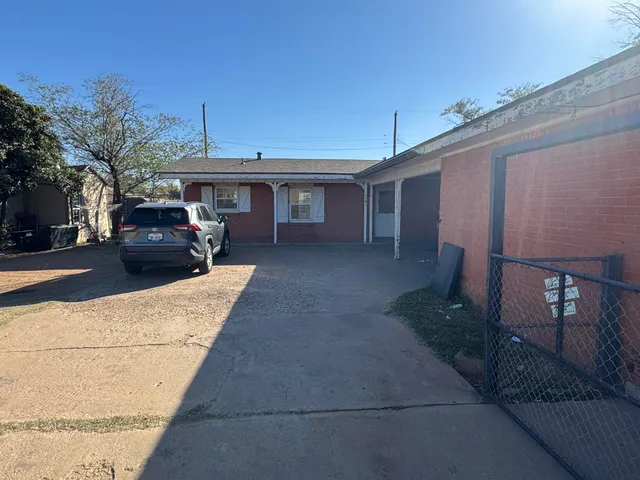 a view of a car parked in front of house