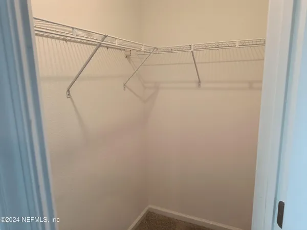 a view of a room with racks on the wall