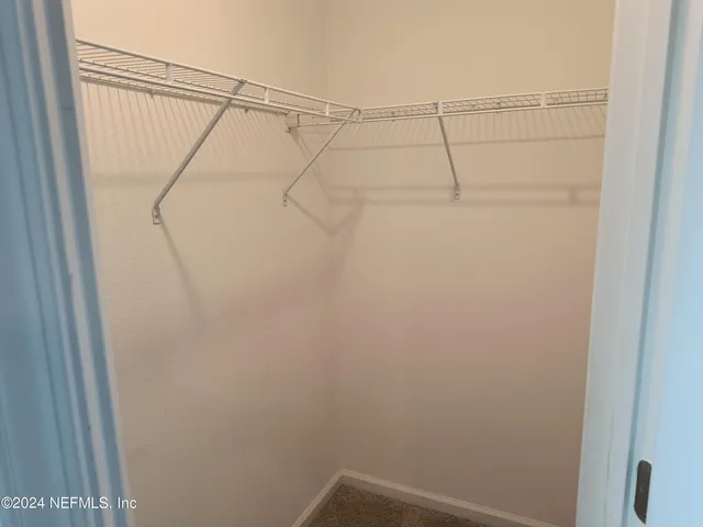 a view of a room with racks on the wall