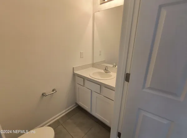 a bathroom with a sink and toilet