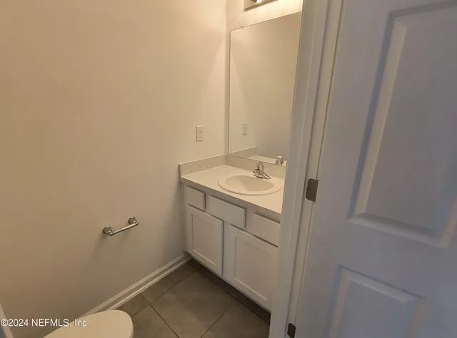 a bathroom with a sink and toilet