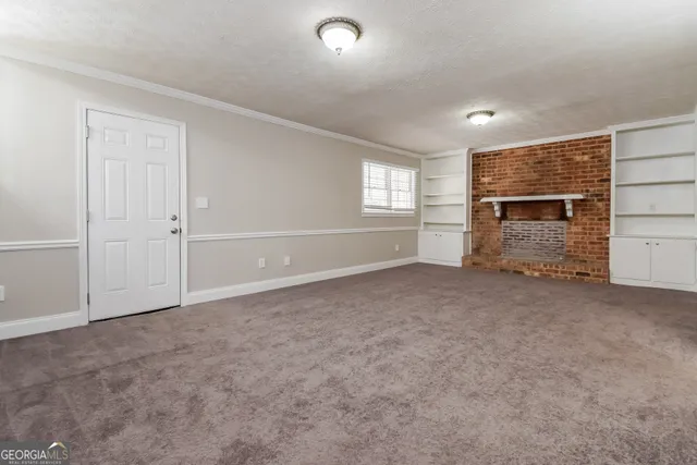 an empty room with a empty space and windows