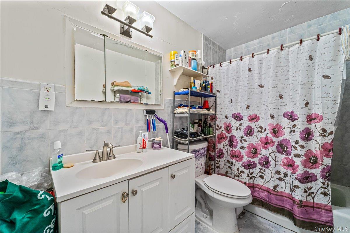 150-02 78th Road Queens, NY 11367 - Photo 20 of 23 a bathroom with a sink toilet and shower