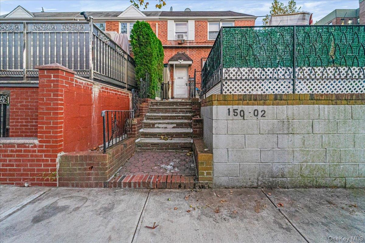 150-02 78th Road Queens, NY 11367 - Photo 2 of 23 a front view of a house