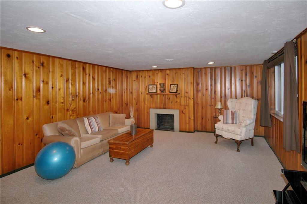 508 Sleepy Hollow Road Pittsburgh, PA 15228 - Photo 20 of 25 Game Room - Paneled walls, fireplace.