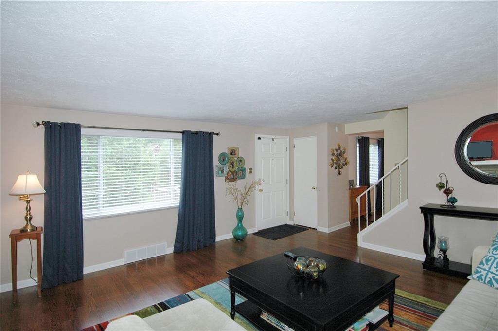 508 Sleepy Hollow Road Pittsburgh, PA 15228 - Photo 4 of 25 Living Room - Coat closet, stairs to second floor, open to the dining room.