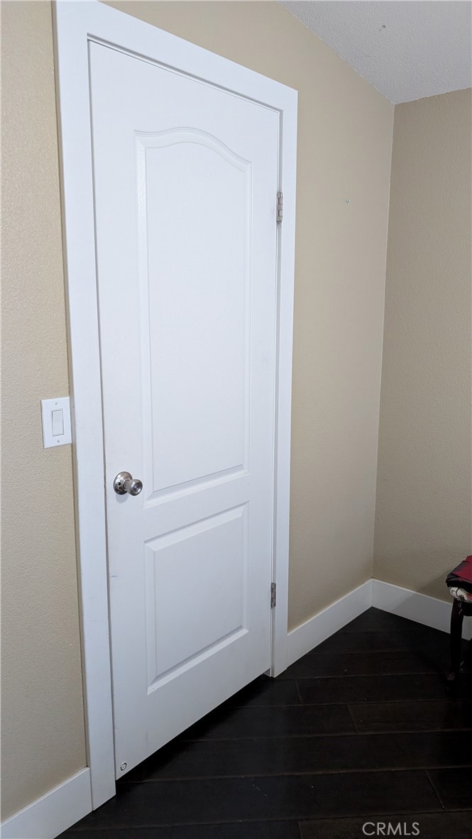 3424 West Washington Avenue, Unit 228 Santa Ana, CA 92703 - Photo 26 of 31 an empty room with wooden floor